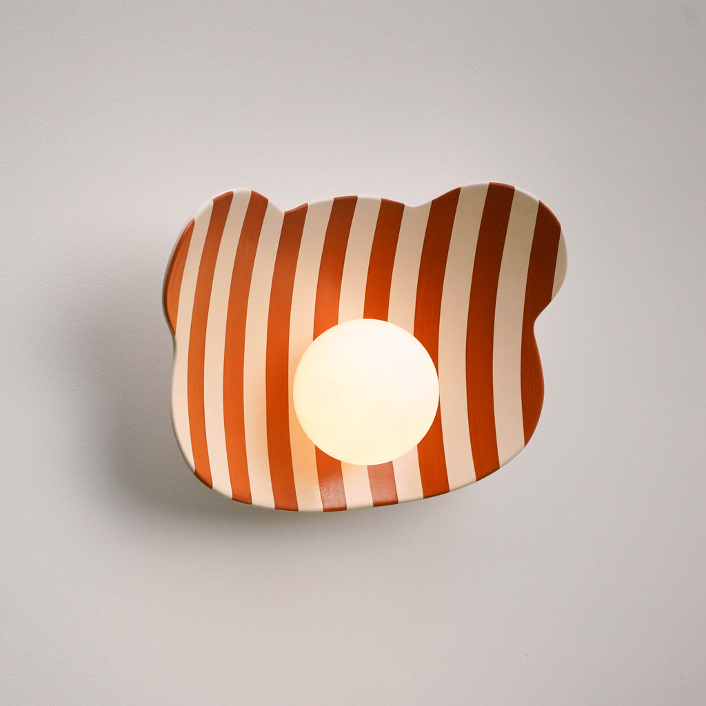 Lámpara de pared/aplique de cerámica con diseño de osito de peluche a rayas para habitación infantil.
